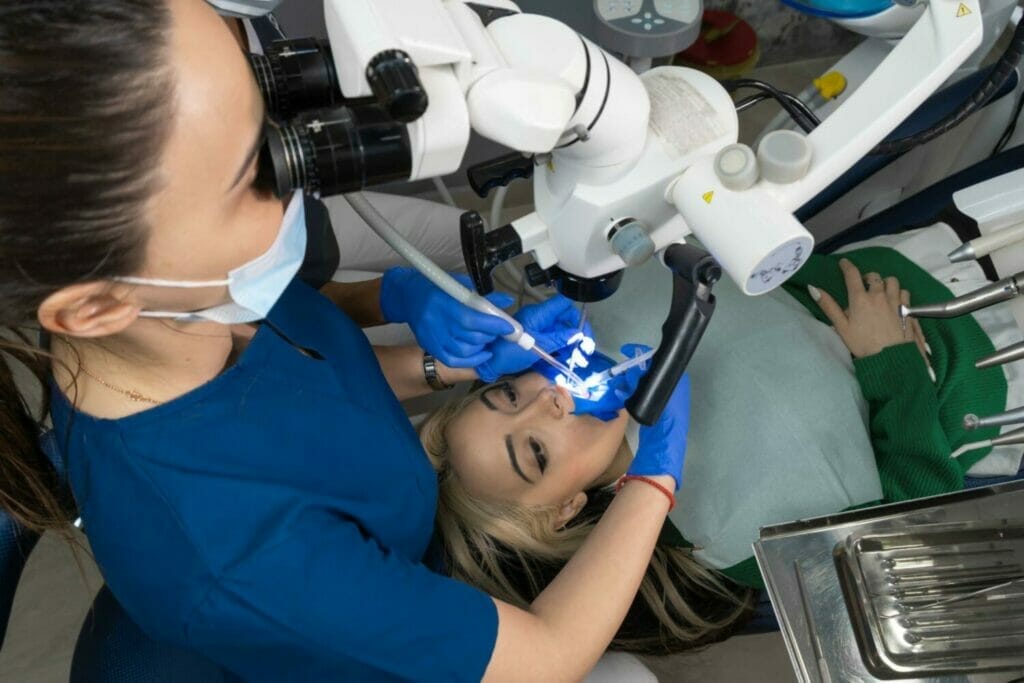 woman being looked at with state-of-the-art dental technology