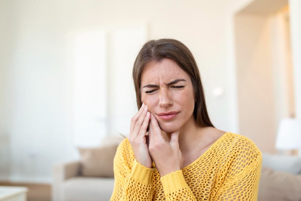 tooth-pain-dentistry-beautiful-young-woman-suffering-from-terrible-strong-teeth-pain-touching-cheek-with-hand-female-feeling-painful-toothache-dental-care-health-concept-high-resolution